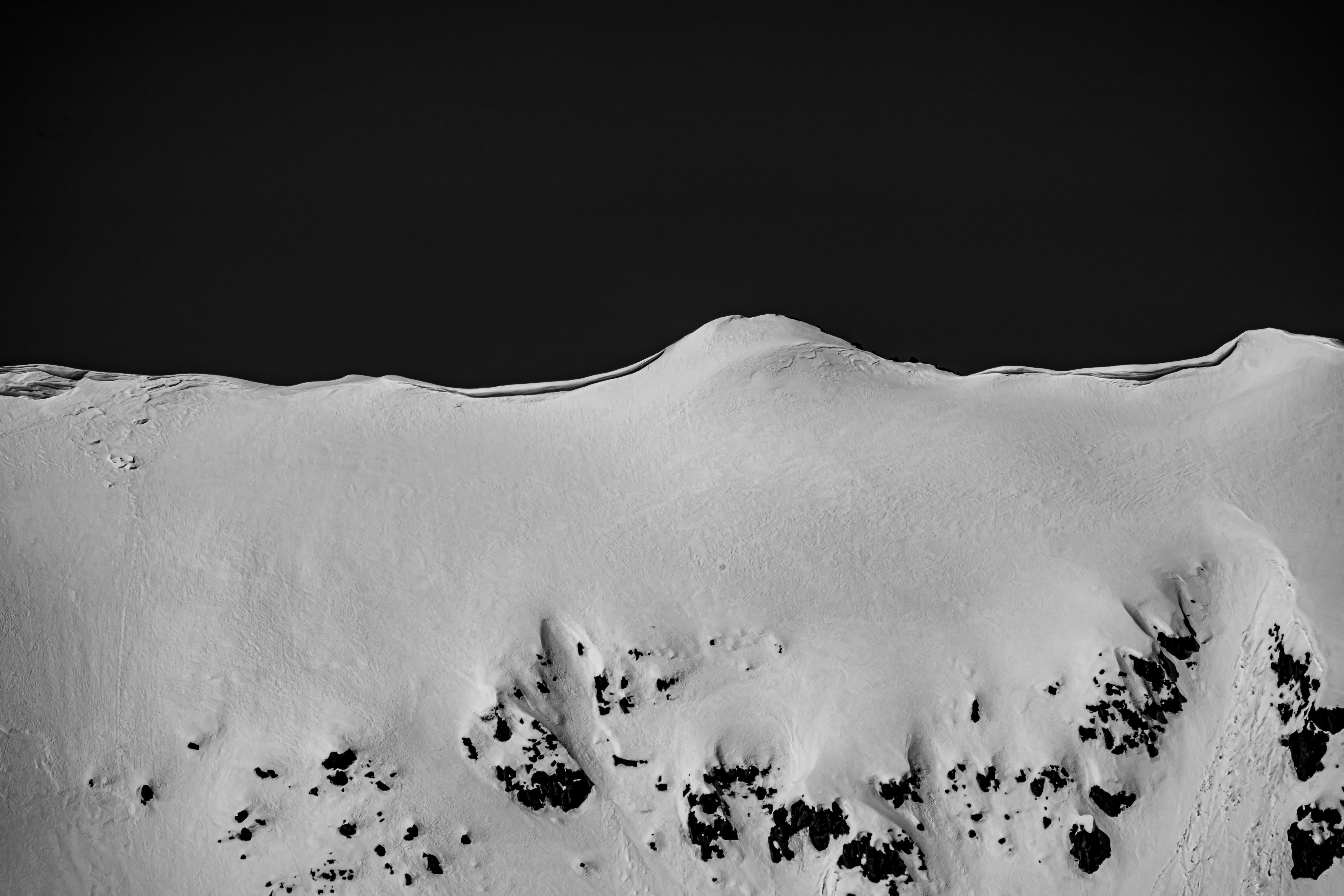 snow covered mountain during daytime